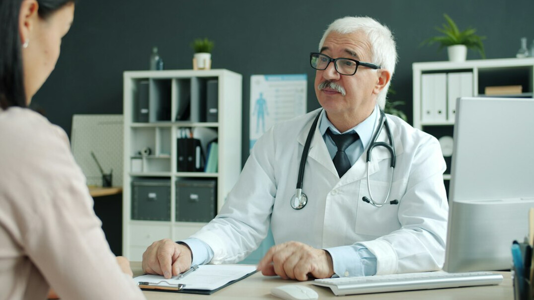 specialist doctor consulting patient